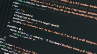 Modern React söz dizimi ve fonksiyonlarını gösteren koyu renk bir ekranda renkli programlama kod kaydırmaları. Titreşim kodlama kavramı, yapay zeka destekli yazılım geliştirme ve makine öğrenme ile uygulamalar oluşturma