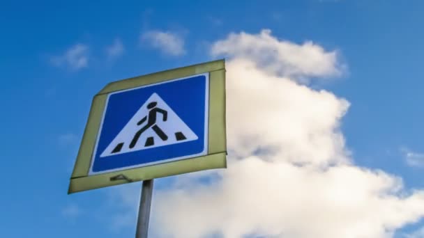 Sign of the pedestrian crossing on background moving clouds. — Stock Video