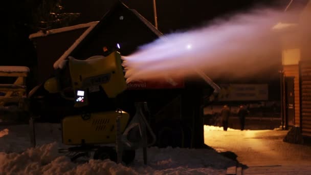 Snow cannons are working at night.