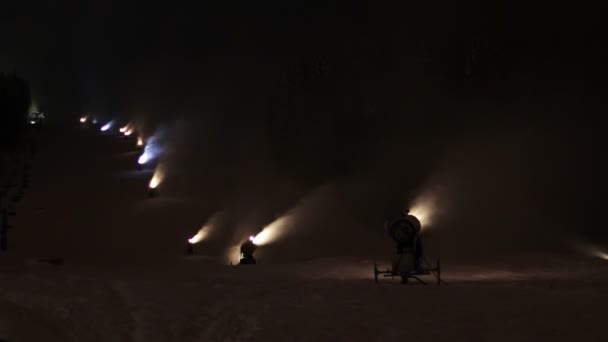 Snow cannons are working at night. — Stock Video