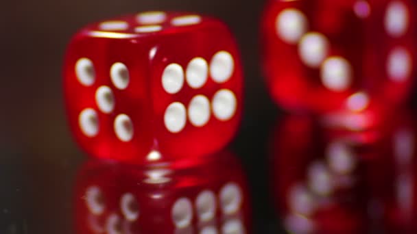 Playing red Casino Dice Cubes on a Glass Table. — Stock Video