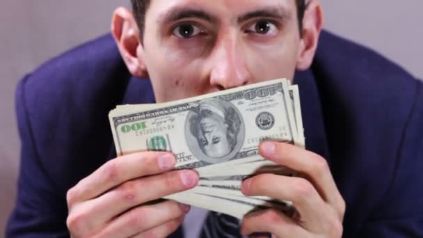 Greedy Businessman sniffing money. — Stock Video