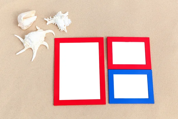 Photo frames on sand — Stock Photo, Image