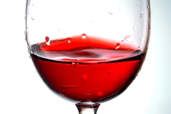 Víno ve skleněných closeup, makro, vlnu, vína, šplouchání, splash, bubliny, textury — Stock fotografie
