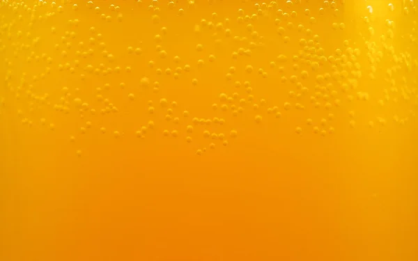 Бульбашки в апельсиновому напої крупним планом текстури фону — стокове фото
