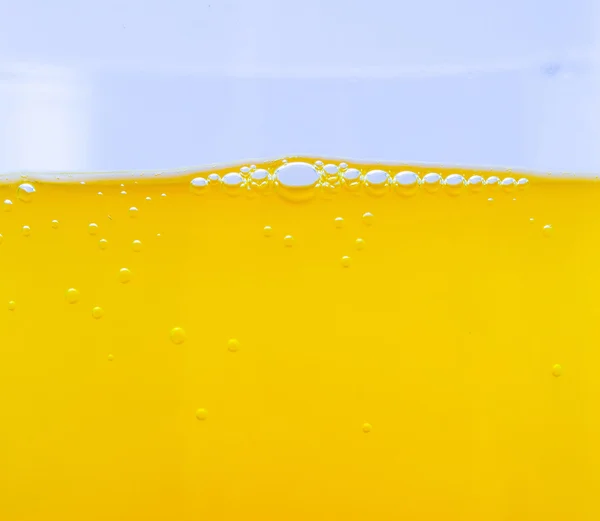 Buborékok, egy narancs ital Vértes — Stock Fotó