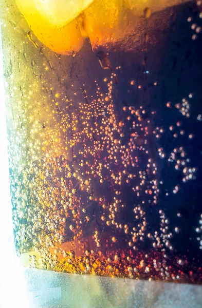 Cola with ice cubes, bubbles macro close up texture — Stock Photo, Image