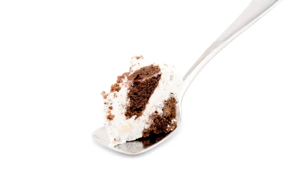 Kawałek ciasta na łyżce na białym tle — Zdjęcie stockowe