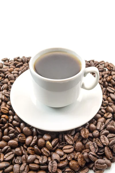 Cup of coffee on coffee beans isolated on white background Stock Photo