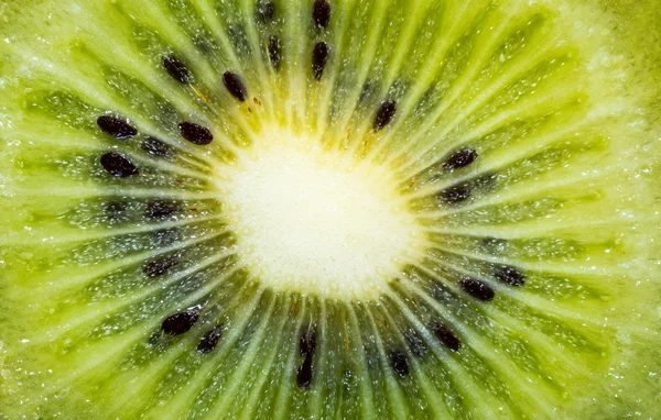 Plasterki kiwi owoc rdzeń makro. Tło i tekstura — Zdjęcie stockowe