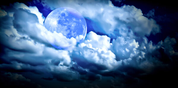 Full moon in the blue cloudy sky, it's like a fairytale