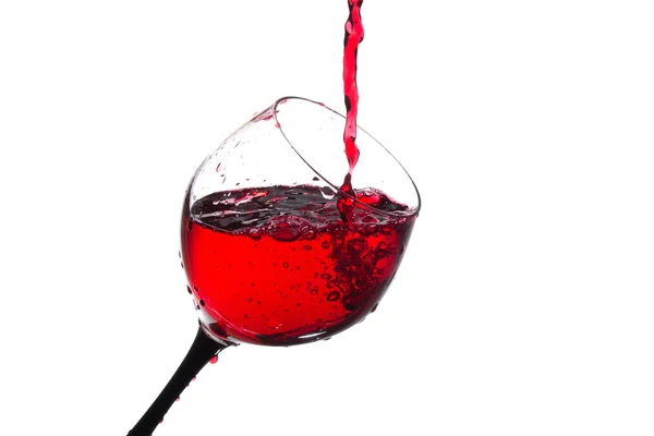 Stream of wine being poured into a glass isolated — Stock Photo, Image