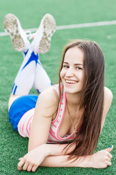 Smiling girl on the soccer field — Stock Photo, Image