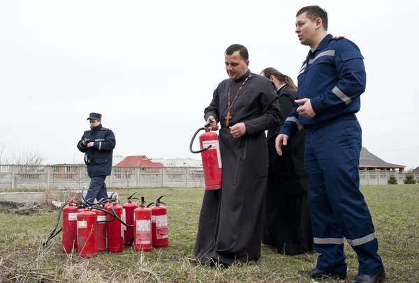 Firefighters and priests — Stock Photo, Image