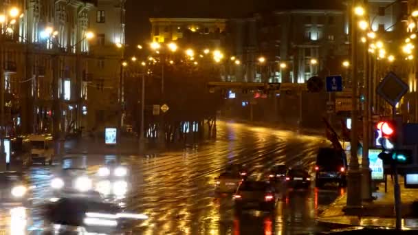 Timelapse of night rainy city street with traffic — Stock Video