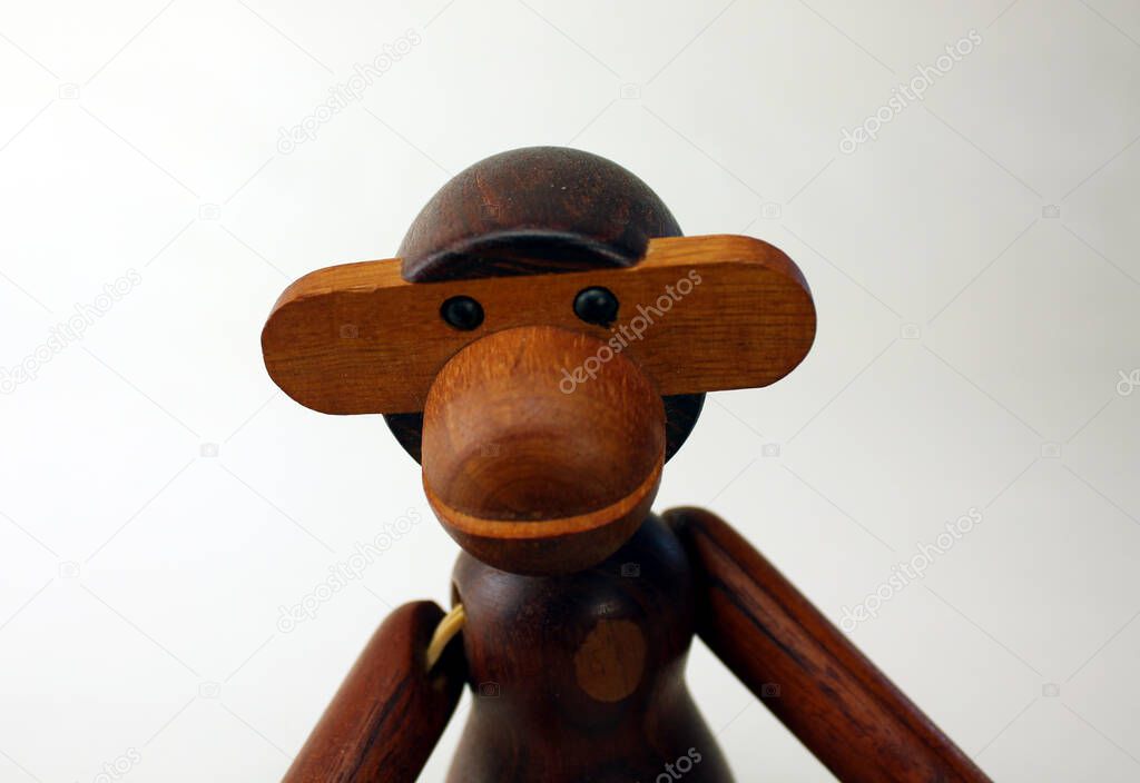 Vintage wood monkey figurine on white background, retro design by Kay Bojesen of Denmark 