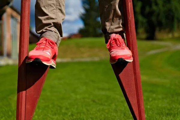 Person Walking Traditional Stilts Park — Stock Photo, Image