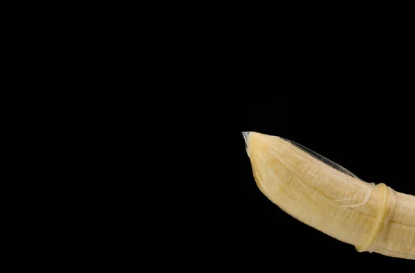 Banana Symbolizing Erect Penis Condom Safe Sex Isolated Black Background — Stock fotografie