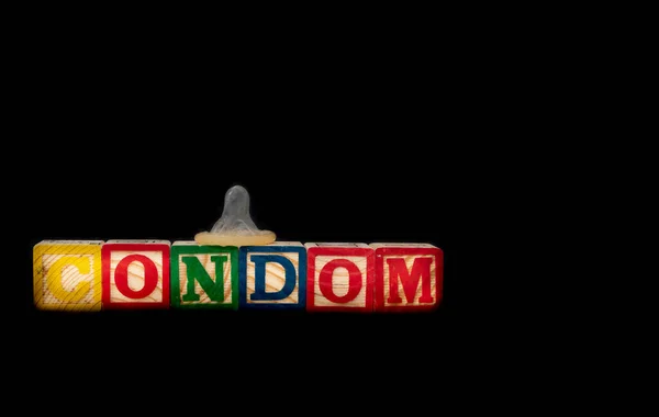 Wood Toy Blocks Spell Out Condom Real Condom One Block — Stock Photo, Image