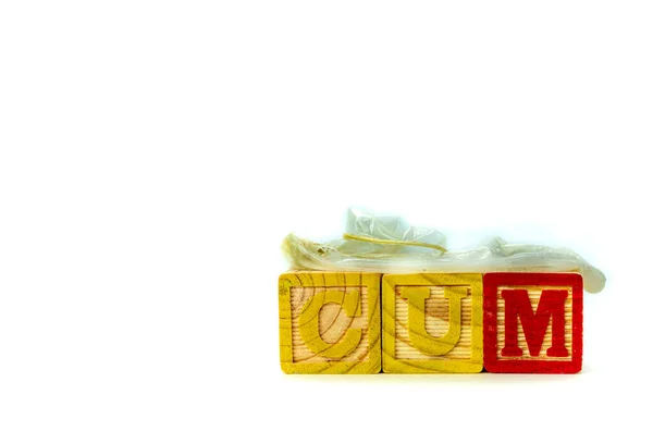 Wood Alphabet Toy Blocks Spell Word Cum Used Condom Top — Fotografia de Stock