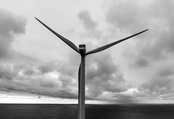 Black White Image Modern Wind Turbine Ocean Stormy Clouds Distance — Stock Photo, Image