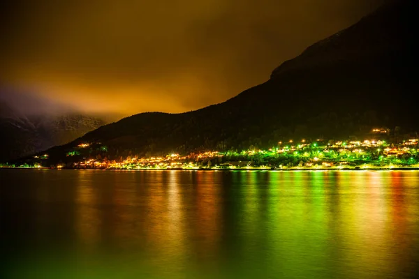 Bright Colorful Lights Town Street Mountain Ridge Fjord Night Clouds — Stockfoto