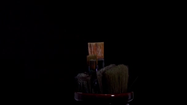 Used Old Paint Brushes Sitting Old Jar Spinning Isolated Black — Stockvideo