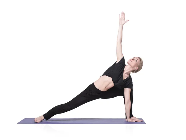 Mujer joven haciendo yoga asana, aislada — Foto de Stock