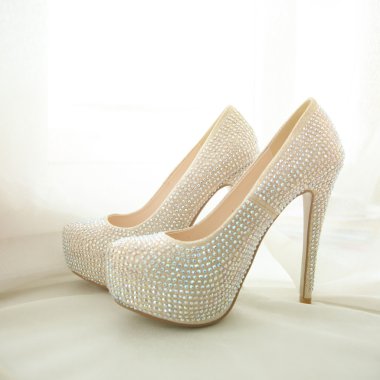 Elegant bridal white shoes with rhinestones clipart