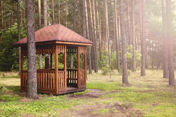 A wooden gazebo in the forest — Stock Photo, Image