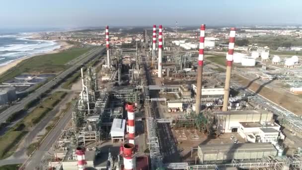 Drone aerial shot factory tubes and chimneys. Panoramic shot of industrial area, grey and foggy sky, health risk area. — Stock Video