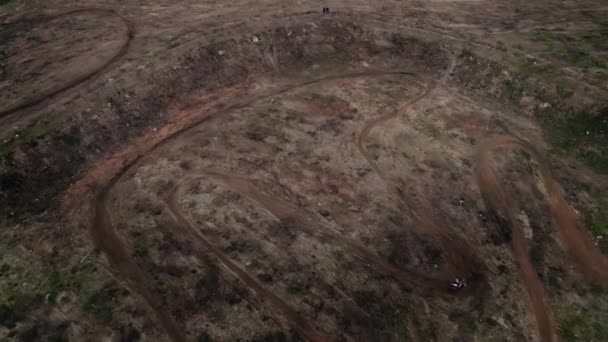 Aerial rotating of motocross track showing the high-performance off-road motorcycles racing — Stock Video