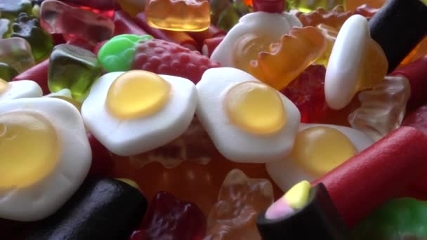 Mixed colorful candies and sweet jellies rotation — Stock Video