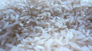 White Rice 'ın tam kare çekimleri. Arkaplan olarak cilalanmış pirinç taneleri