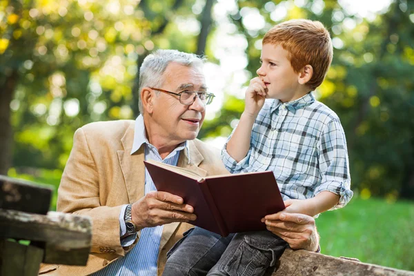 Grandfather and grandson in park — Stock Photo, Image