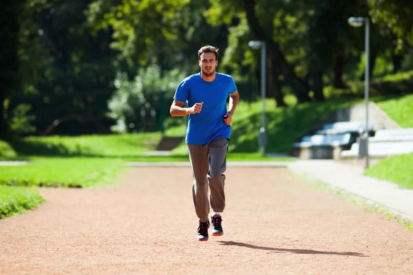 Young man jogging — 图库照片