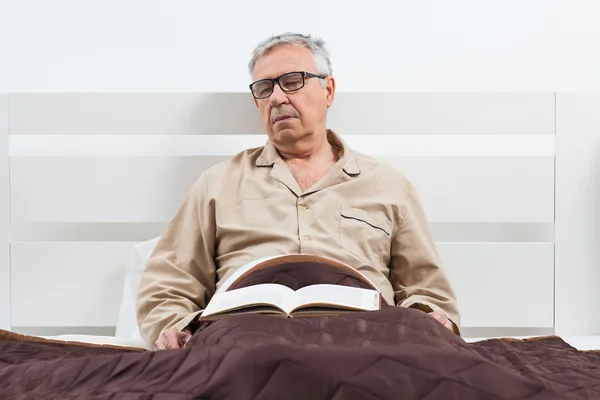 Senior man in bed — Stock Photo, Image