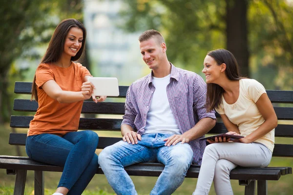 Three friends in park — Stock Photo, Image