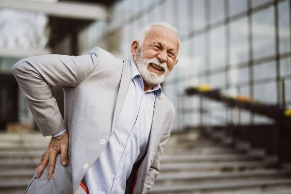 Senior Businessman Having Sprain Back Front Company Building — Stock Photo, Image