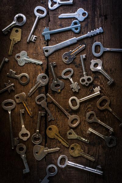 Set of keys on wood background