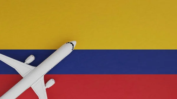Top Down View of a Plane in the Corner on Top of the Country Flag of Colombia