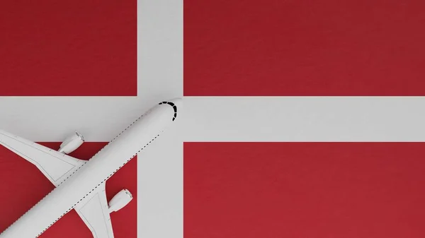 Top Down View of a Plane in the Corner on Top of the Country Flag of Denmark
