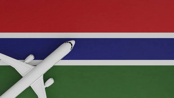 Top Down View of a Plane in the Corner on Top of the Country Flag of Gambia The