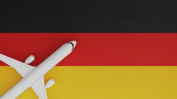 Top Down View of a Plane in the Corner on Top of the Country Flag of Germany