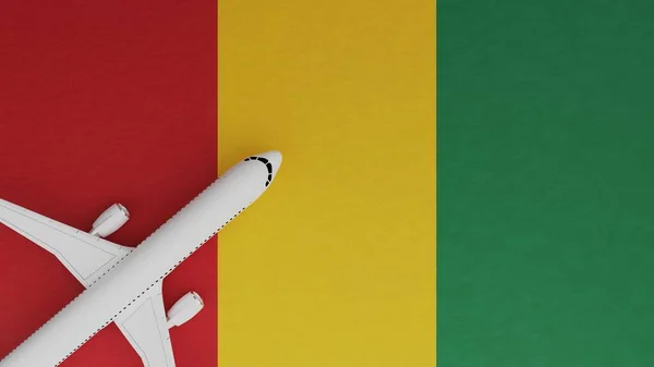 Top Down View of a Plane in the Corner on Top of the Country Flag of Guinea