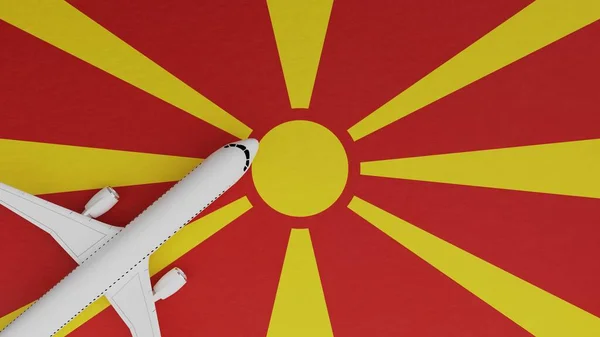 Top Down View of a Plane in the Corner on Top of the Country Flag of Macedonia