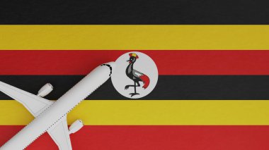 Uganda bayrağının tepesindeki köşede bir uçağın yukarıdan görünüşü