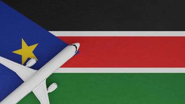 Top Down View of a Plane in the Corner on Top of the Country Flag of South Sudan