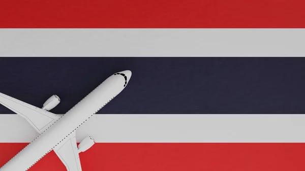 Top Down View of a Plane in the Corner on Top of the Country Flag of Thailand