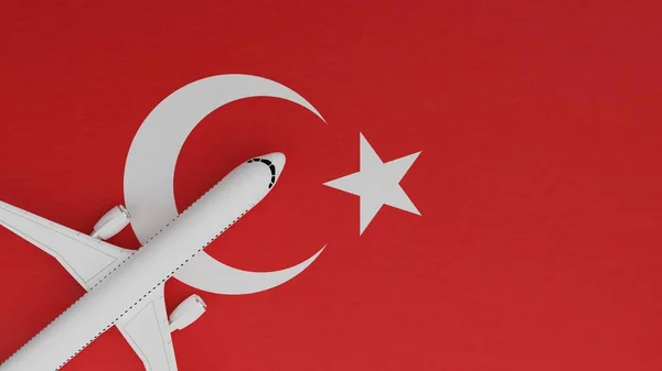 Top Down View of a Plane in the Corner on Top of the Country Flag of Turkey